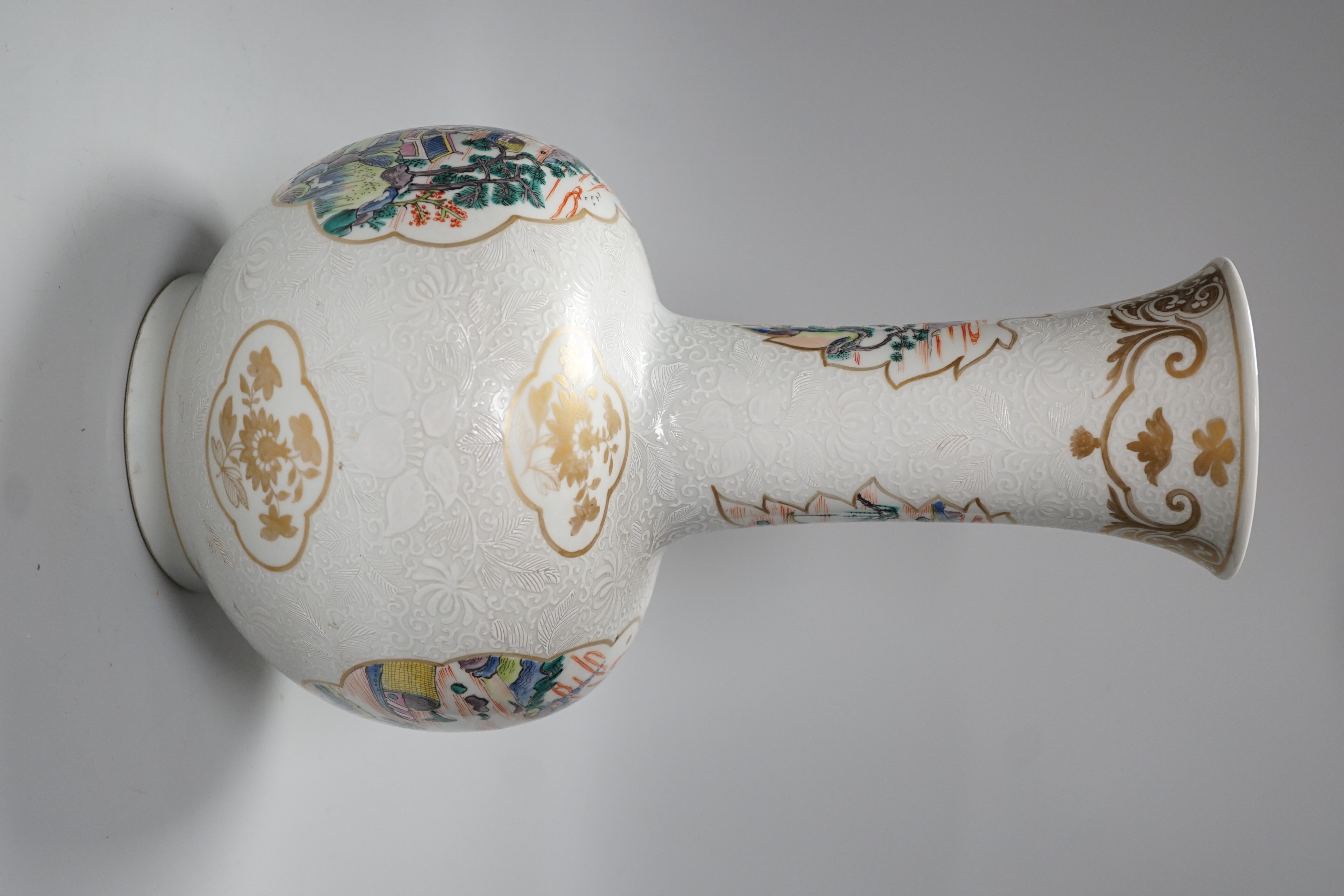 A Chinese enamelled porcelain bottle vase, 36cm, with bianco sopra bianco borders, base drilled